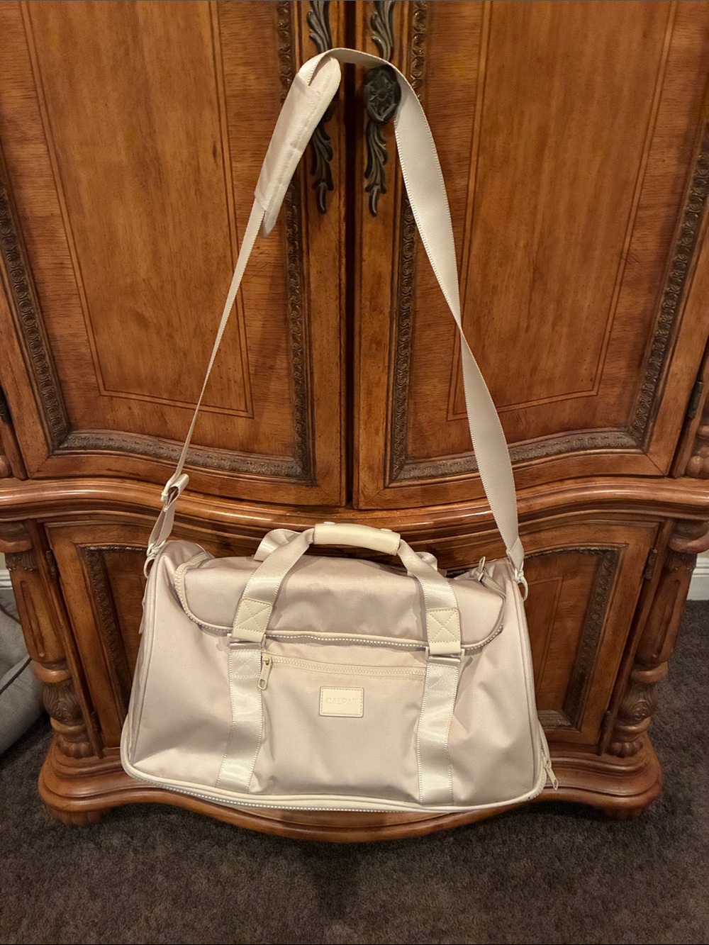 Calpak  women’s Beige Travel Duffel Bag with Adjustable Shoulder Strap
